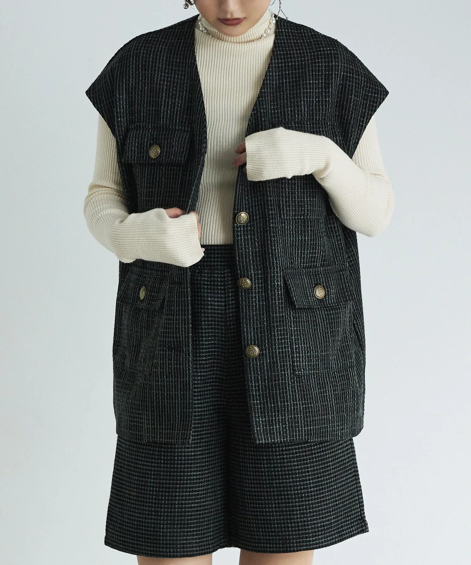 Tweed sleeveless jacket